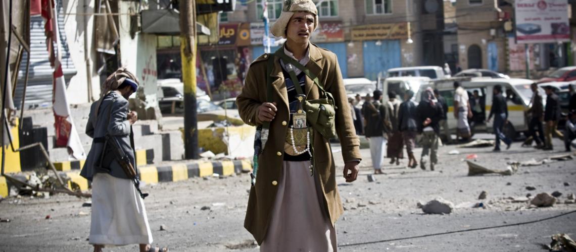 ©Reuters Houthi fighter guards a Sana'a street