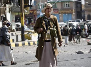 ©Reuters Houthi fighter guards a Sana'a street